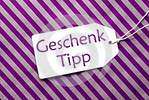 Label On Purple Wrapping Paper, Geschenk Tipp Means Gift Tip