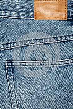 Label sewed on a blue jeans