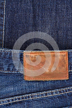 Label sewed on a blue jeans