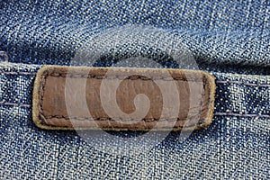Label sewed on a blue jeans..
