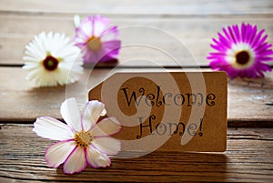 Label With Text Welcome Home With Cosmea Blossoms photo