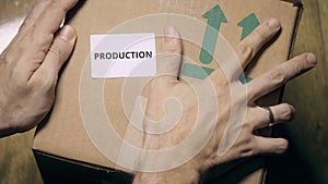PRODUCTION sticker on a carton photo
