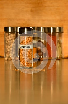 Labelled glass jar of mustard seeds