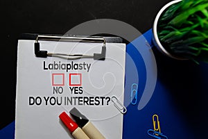 Labiaplasty, Do You Interest? Yes or No. On office desk background photo
