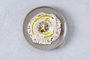 Labneh yogurt, cream  cheese with olive oil and zaatar . Traditional middle eastern arabic breakfast dip.Top view