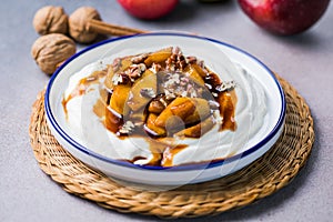 Labneh yogurt cream cheese with roasted apples, copy space. Traditional arabian or middle eastern homemade labneh dip. Greek