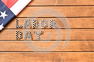 Labor day. American flag on wooden background .