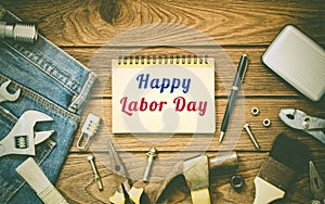 Labor day background concept - Jeans, many handy tools, notebook