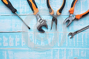 Labor day Concept. Construction tools on blue wooden background