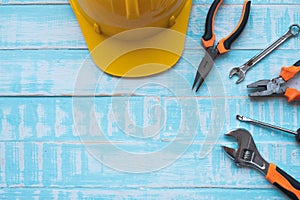 Labor day Concept. Construction tools on blue wooden background