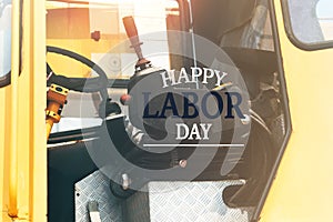 Labor Day Concept. excavator driver seat closeup with word Happy Labor Day