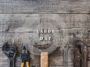 LABOR DAY. Hand tools and wooden letters