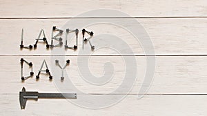 Labor day. Inscription labor day on a light wooden background