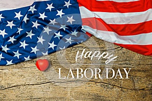 Labor Day Text and Little Red Heart Over Old Wood Wall Texture Background and American Flags