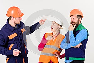 Labor dispute concept. Builders and engineer arguing,