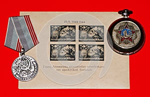 Labor veteran medal and miniature sheet devoted to the end of the siege of Leningrad in January 1944