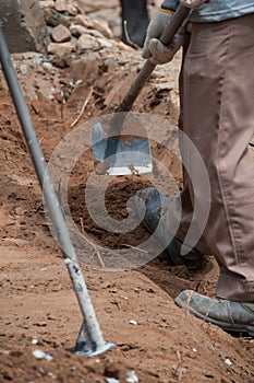 Labor work with spade for excavation