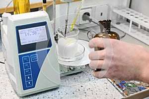 Laborant makes test in laboratory