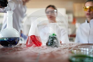 Laborant technicians conducting chemical reactions experiment