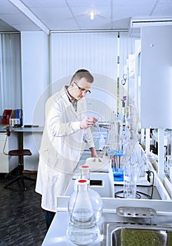 Laboratory assistant works in chemical laboratory