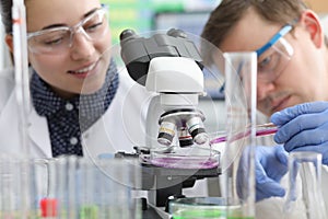 Laboratory assistants conduct chemical examination