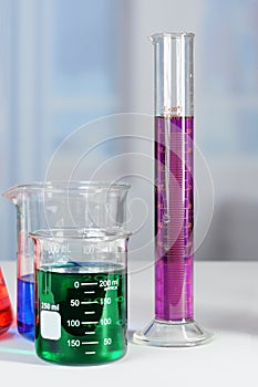 Laboratory Beakers and Graduated Cylinder on Table