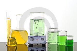 Laboratory equipment. Beakers, erlenmeyer flasks and magnetic stirrer