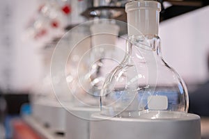 Laboratory equipment - empty glass flask on heating mantle in row