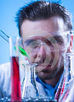 Laboratory equipment, Man in the lab experimenting photo