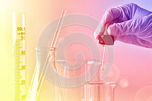 Laboratory experiment, Scientist or chemist`s hand dropping substances for discover new drugs, Research and development photo