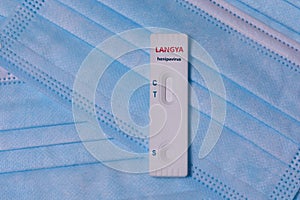Laboratory Express test Schnelltest with Langya henipavirus LayV on a medical masks.The virus is transmitted from animals to photo