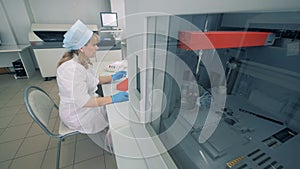 Laboratory facility with a biochemical analyzer and a lady specialist