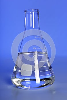 Laboratory Flask on Blue Background