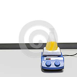 laboratory flask with liquid vibrates and is stirred in the laboratory