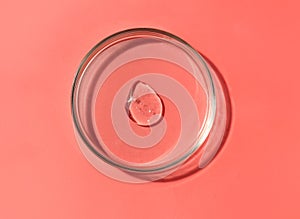 Laboratory glass petri dish for water, serum, oil, beauty product presentation. Natural medicine
