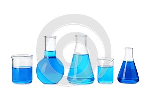 Laboratory glassware with blue liquids isolated