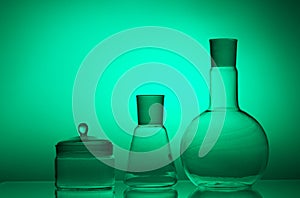 Laboratory glassware on color background