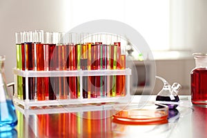Laboratory glassware with color liquids on table