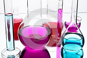 Laboratory glassware with colorful chemicals