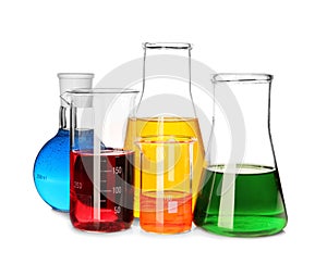 Laboratory glassware with colorful liquids on white background