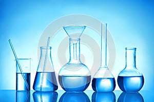 Laboratory glassware with liquid samples for analysis on background