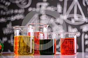 Laboratory glassware with liquids of different color
