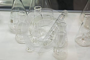 Laboratory glassware for liquids on white background. Test tubes on a white background