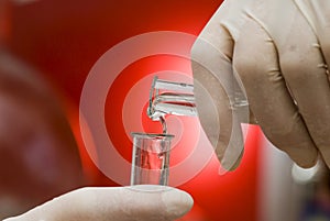 Laboratory glassware on a red background