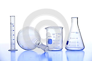 Laboratory Glassware on Reflective Table