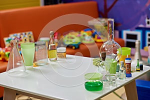 Laboratory glassware on table in playroom.