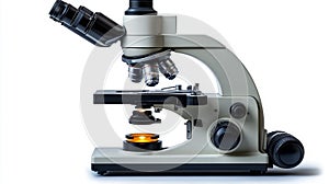 Laboratory microscope side view with multiple objective lenses on white background.