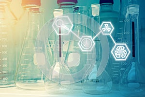 Laboratory Research - Scientific Glassware or beakers with Science icons For Chemical Background concept