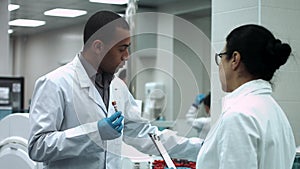 Laboratory researchers discuss work at the laboratory