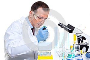 Laboratory scientist using a multi channel pipette